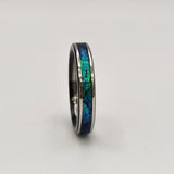 Hand-turned green dichroic resin ring shifting blue and green in the light