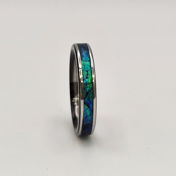 Hand-turned green dichroic resin ring shifting blue and green in the light