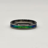 Hand-turned green dichroic resin ring shifting blue and green in the light