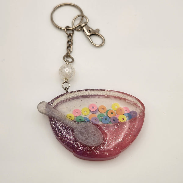 Cereal bowl shaker keychain filled with oil and floating charms