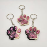 Hand-poured resin pawprint keychain supporting animal rescue