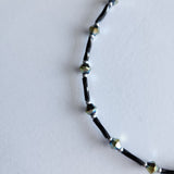 Handmade black and iridescent glass bead ankle bracelet by Blue Bourbon Designs