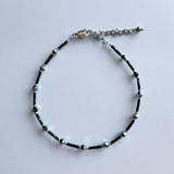 Handmade black and iridescent glass bead ankle bracelet by Blue Bourbon Designs