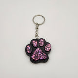 Hand-poured resin pawprint keychain supporting animal rescue