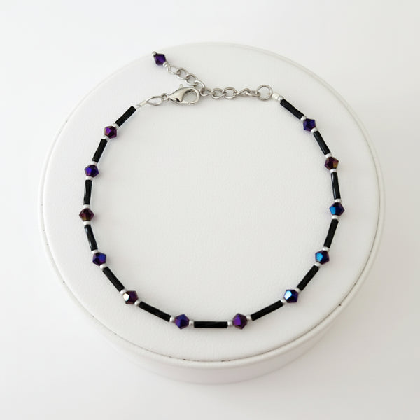Handmade black and purple iridescent glass bead ankle bracelet by Blue Bourbon Designs.
