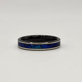 Hand-turned dichroic resin ring on a 2mm stainless steel band shifting blue and green in the light