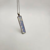 Caribbean dichroic pendant with iridescent Dichrolam resin on stainless steel chain.