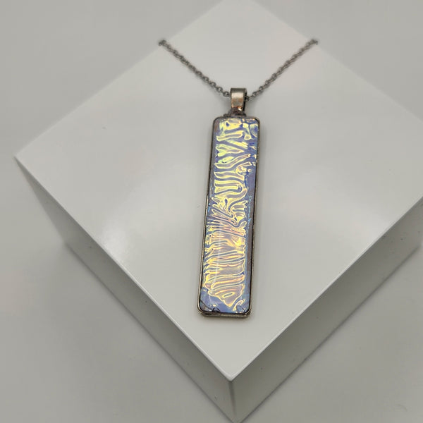 Caribbean dichroic pendant with iridescent Dichrolam resin on stainless steel chain.