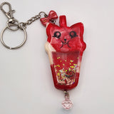 Cat drink shaker keychain filled with oil and floating charms
