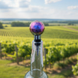 Handmade color-shifting resin wine stopper that transitions from plum to gold
