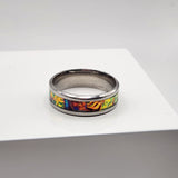 Dichroic resin ring with yellow, orange, and green color-shifting effect
