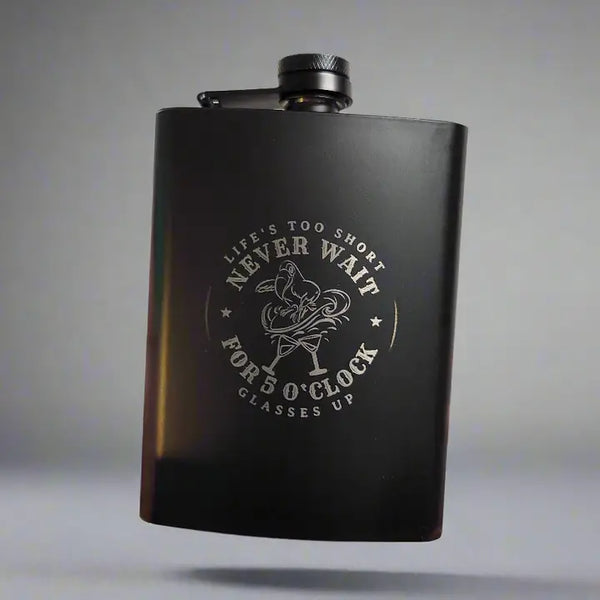 Laser-etched metal flask with drinking design