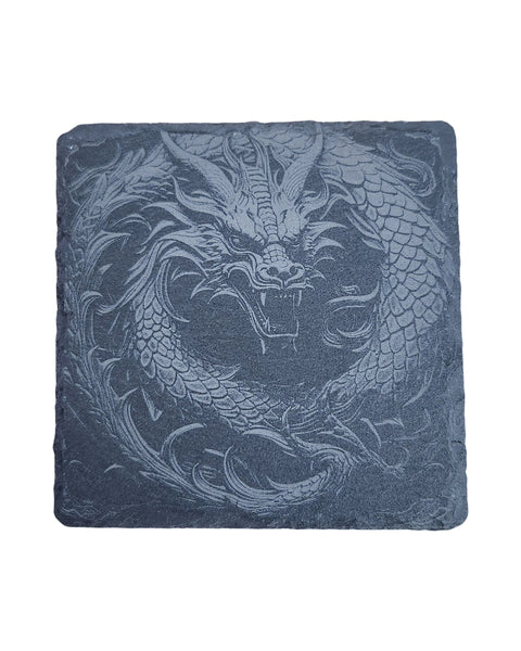 A dark slate coaster with an engraved image of a dragon.