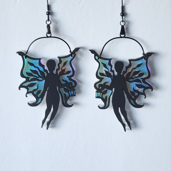Laser cut fairy earrings with black painted wood bodies and iridescent acrylic wings