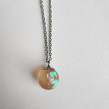 Faux opal resin necklace with iridescent color-shifting material on stainless steel chain