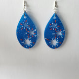 Star teardrop resin earrings on stainless steel hooks in multiple colors