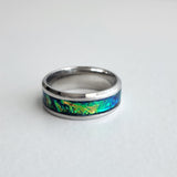 Hand-turned green dichroic resin ring shifting blue and green in the light