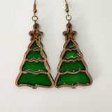 A pair of earrings featuring a Christmas tree design with a green resin and brown wood