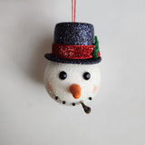 Handcrafted snowman ornament with snowy texture and glitter hat by Blue Bourbon Designs