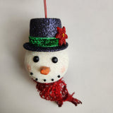 Handcrafted snowman ornament with snowy texture and glitter hat by Blue Bourbon Designs