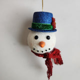 Handcrafted snowman ornament with snowy texture and glitter hat by Blue Bourbon Designs