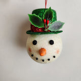 Handcrafted snowman ornament with snowy texture and glitter hat by Blue Bourbon Designs