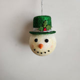 Handcrafted snowman ornament with snowy texture and glitter hat by Blue Bourbon Designs