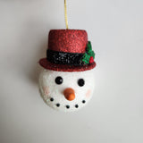 Handcrafted snowman ornament with snowy texture and glitter hat by Blue Bourbon Designs