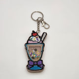 Ice-cream shake shaker keychain filled with oil and floating charms.