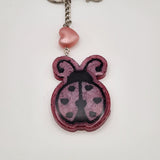 Hand-painted resin ladybug keychain with clear resin topcoat
