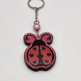 Hand-painted resin ladybug keychain with clear resin topcoat