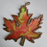 Handmade wooden maple leaf filled with resin in fall colors by Blue Bourbon Designs