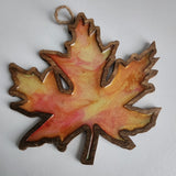 Handmade wooden maple leaf filled with resin in fall colors by Blue Bourbon Designs