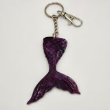 Hand-poured resin mermaid tail keychain in unique colors.