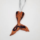 Hand-poured resin mermaid tail ornament in multiple colors.