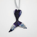 Hand-poured resin mermaid tail ornament in multiple colors.