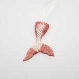 Hand-poured resin mermaid tail ornament in multiple colors.