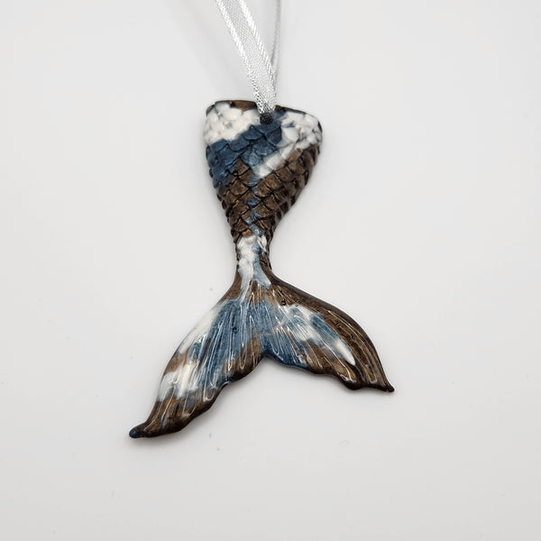 Hand-poured resin mermaid tail ornament in multiple colors.