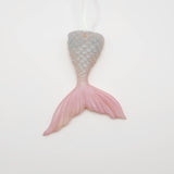 Hand-poured resin mermaid tail ornament in multiple colors.