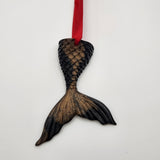 Hand-poured resin mermaid tail ornament in multiple colors.