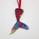 Hand-poured resin mermaid tail ornament in multiple colors.