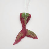 Hand-poured resin mermaid tail ornament in multiple colors.