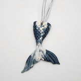 Hand-poured resin mermaid tail ornament in multiple colors.