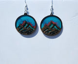 One-of-a-kind mountain earrings made from laser cut wood and resin with stainless steel hooks