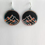 One-of-a-kind mountain earrings made from laser cut wood and resin with stainless steel hooks