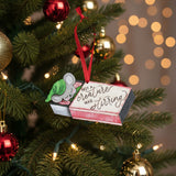 Wooden layered Christmas ornament reading ‘Not a Creature Was Stirring