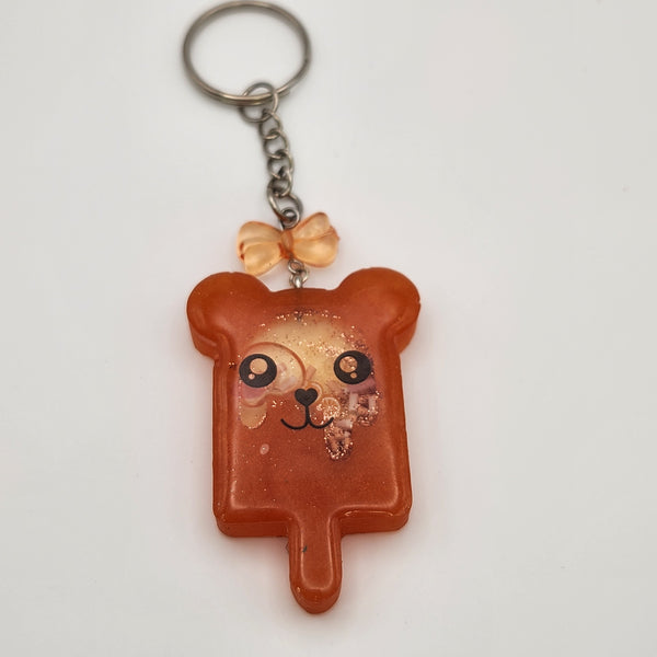 Bear popsicle shaker keychain filled with oil and floating charms