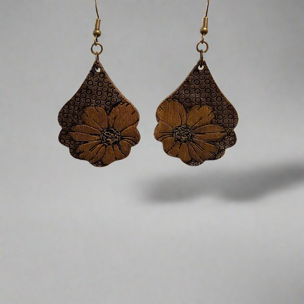 A pair of hand painted floral wood earrings with brass hooks