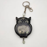 Owl shaker keychain filled with oil and floating charms