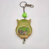 Owl shaker keychain filled with oil and floating charms